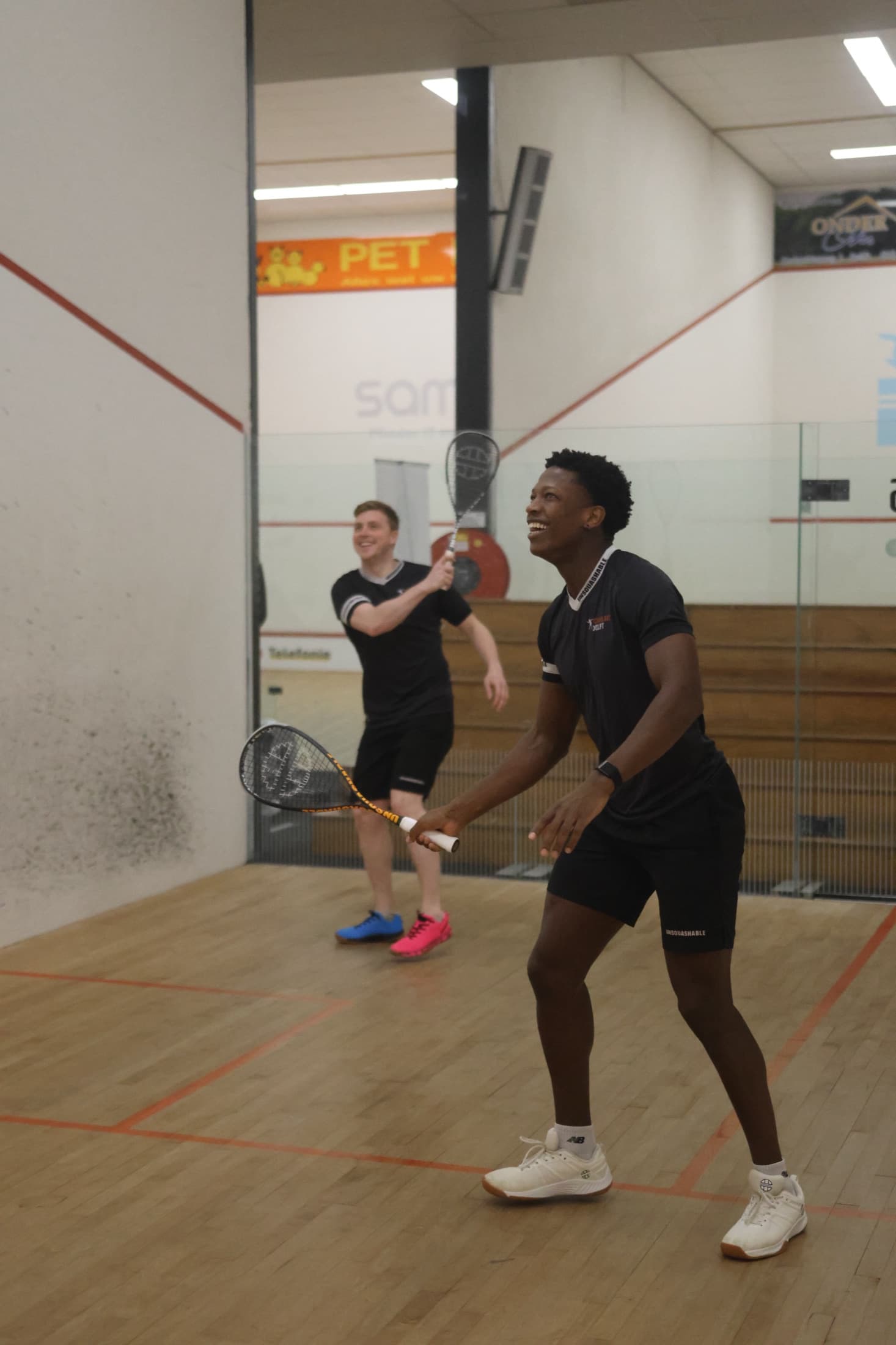 Squash player training at pace during an international camp block